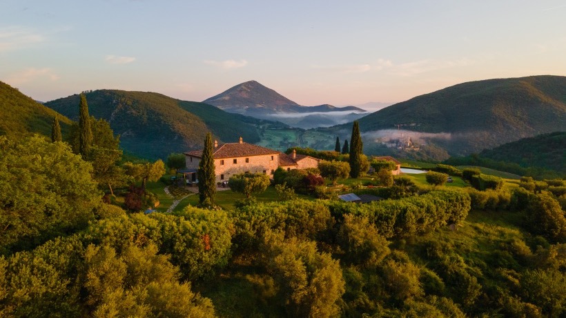 The historic farmhouse crowns a hill in heart of Umbria.